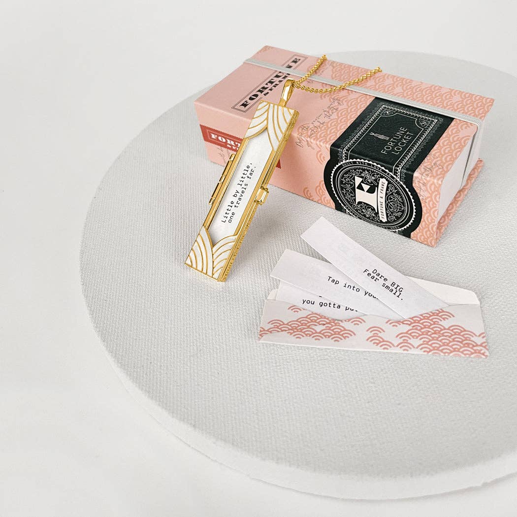 Decorative bookmarks and packaging on a white surface